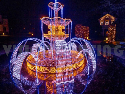 Illuminated Fountain In Garden