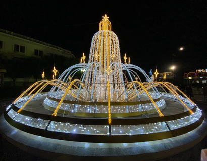 Illuminated Fountain In Garden