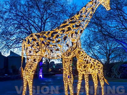 Illuminated Giraffe In Amusement Park
